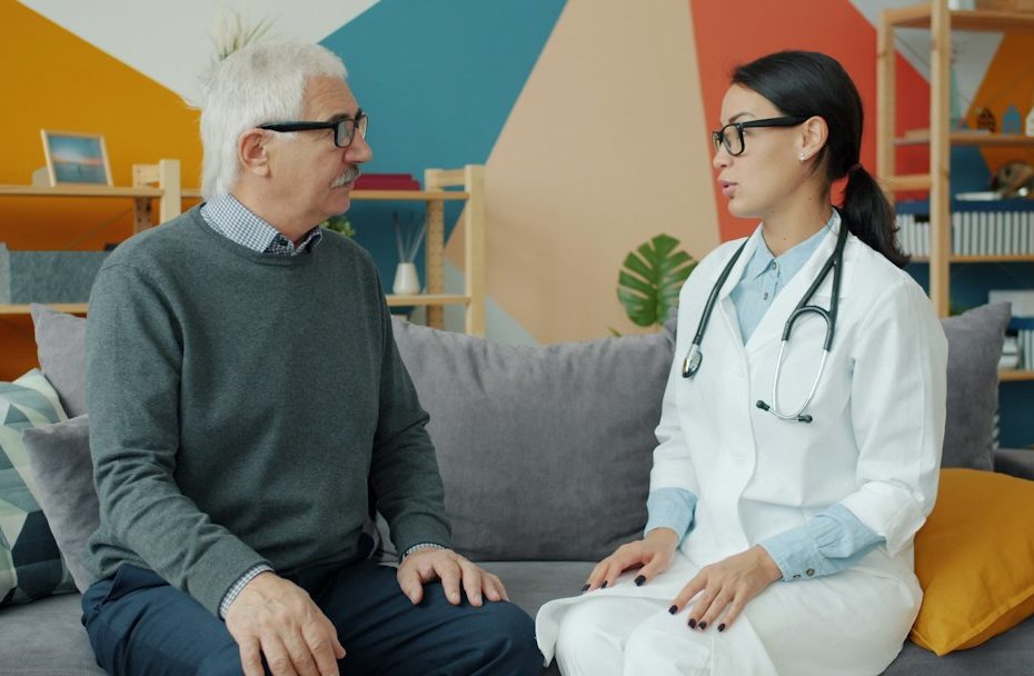 Doctor speaking with a patient during a home medical assessment